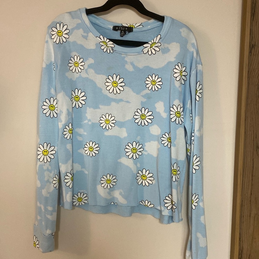Kids sweatshirt with flowers and clouds.